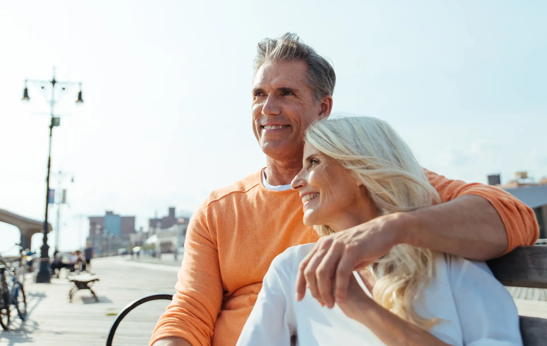 Couple relaxing on a bench along the Long Branch boardwalk